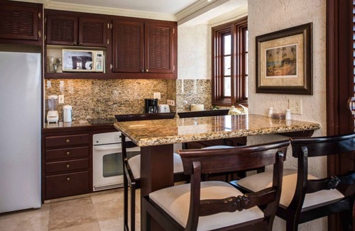 Diamond Valley Resort | 1BR/2BA Suite - Kitchen, Living Room & Balcony - Private Resort on Crane Beach!n
