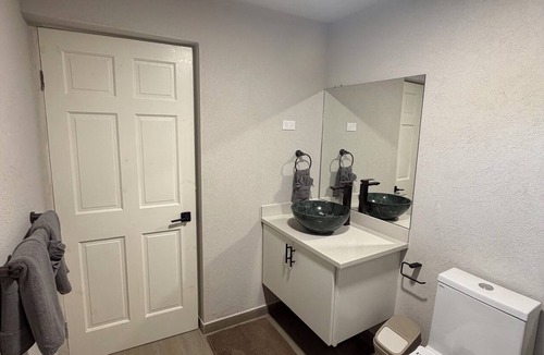 Derricks Apartment | 2 bed 1 bath apartment w/AC, WIFI, kitchen & 5 min walk to west coast beaches