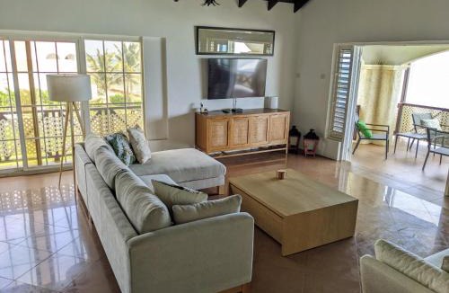 Oistins Apartment | Breezy Ocean Front Condo Close to The Best Beaches