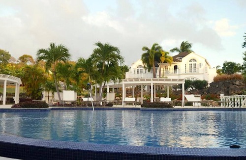 Merlin Bay Apartment | Caribbean Queen is located on the exclusive Royal Westmoreland Golf Resort