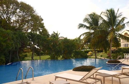 Merlin Bay Apartment | Caribbean Queen is located on the exclusive Royal Westmoreland Golf Resort