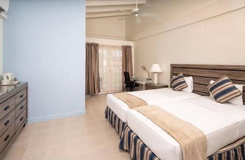 Dover Hotel | Enjoy Great Games and Events at Garrison Savannah! FREE Parking, Outdoor Pool!