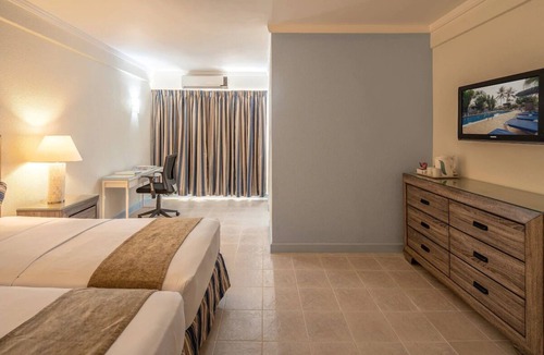 Dover Hotel | Enjoy Great Games and Events at Garrison Savannah! FREE Parking, Outdoor Pool!