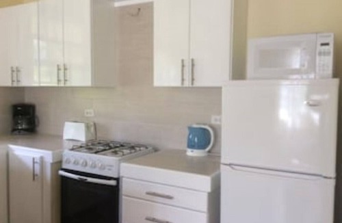 Sunset Crest Apartment | Ground Floor Apt with garden only 3 mins walk to Beach and Beach Club