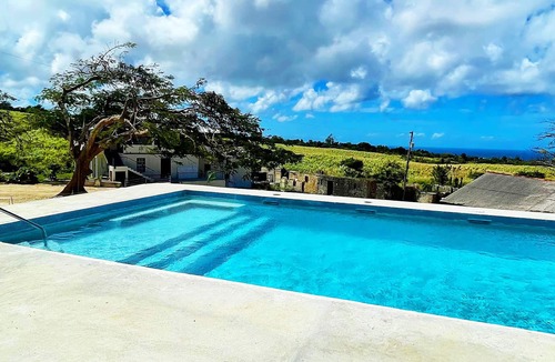 Gibbs Bay Apartment | Historic sea view 1 bed apartment in restored stone house