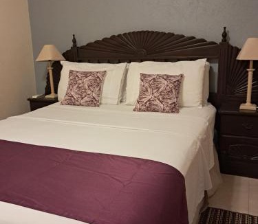 Charnocks Apartment | Michand Guest Apartments- Cozy one or two bedroom- 5 walk minutes from airport 10 mins drive to Oistins or beach