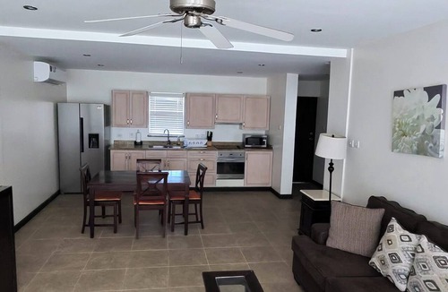 Marine Gardens Condo | Modern 1-bedroom condo ,180m from beach ,with pool , AC and gym access