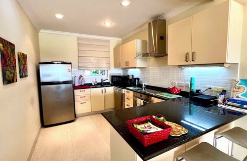 Callendar Condo | Nestled on the prestigious Barbados Golf Course, this charming two-bedroom called “Island Time”