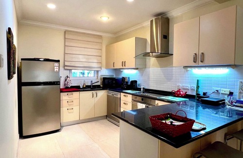 Callendar Condo | Nestled on the prestigious Barbados Golf Course, this charming two-bedroom called “Island Time”