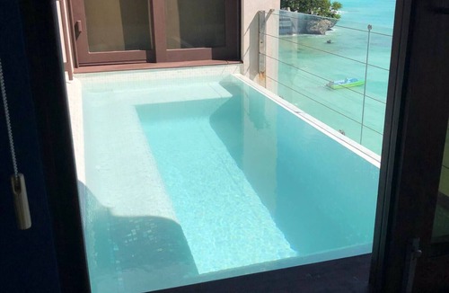 Worthing Condo | Ocean Reef Penthouse Cottage