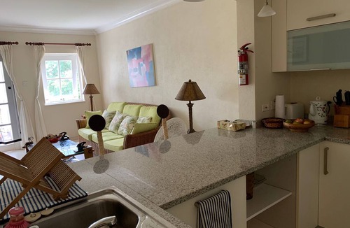 Rendezvous Condo | One-bedroom 15 minute walk to white sandy beach with shared pool