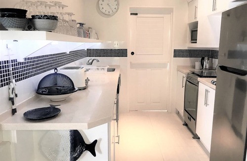 Porters Cottage | Stylish luxury traditional-style poolside villa nr. beach. Two ensuite bedrooms.