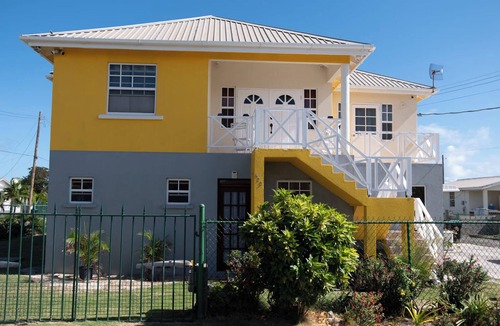 Ragged Point Apartment | The apartment features an open plan living and dining area, and a spacious and modern kitchen.