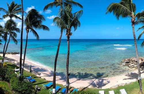 Reeds Bay Condo | This Penthouse is situated directly on a beautiful sandy beach and has a wonderful roof deck terrace