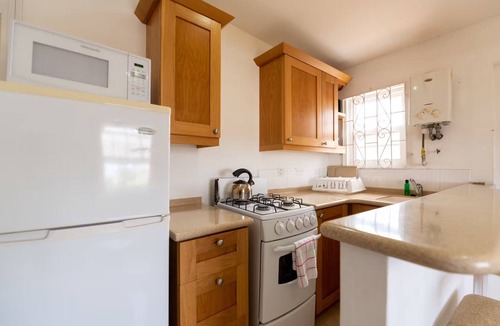 Blue Waters Hotel | Your Home Away from Home by Rockley Beach; Pool, Gardens & Full Kitchen