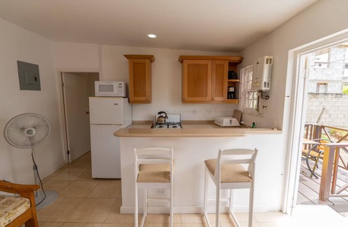 Blue Waters Hotel | Your Home Away from Home by Rockley Beach; Pool, Gardens & Full Kitchen