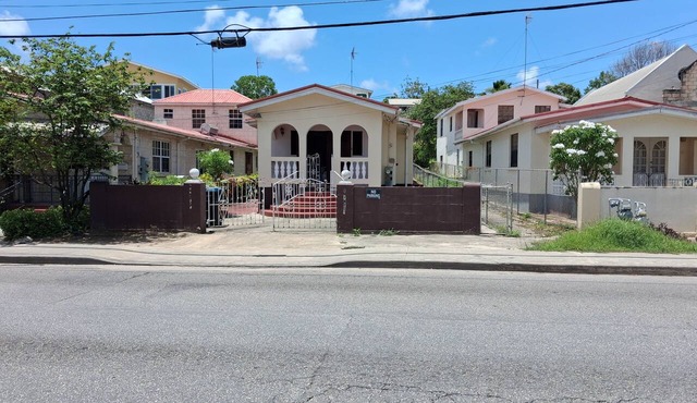 Budget bungalow across the road from the calm west coast sandy beach in Paynes Bay Beach