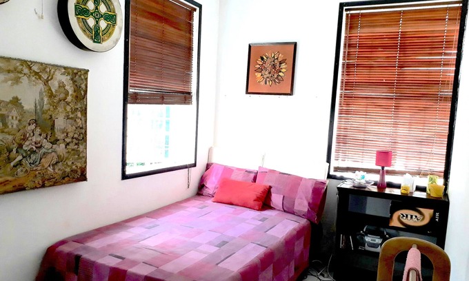 Two Mile Hill House | Eco-friendly Conch room in the Hummingbird apartment