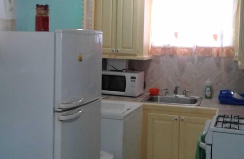 Maynards Apartment | Tropical Petal Apt. for Two-w a/c, k-sized bed TV, super wi-fi.