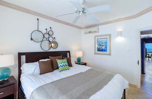 Merlin Bay Apartment | Caribbean Queen is located on the exclusive Royal Westmoreland Golf Resort