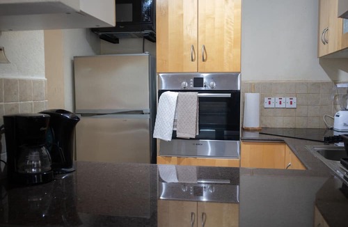 Blue Waters Condo | Ideally located condo with a pool