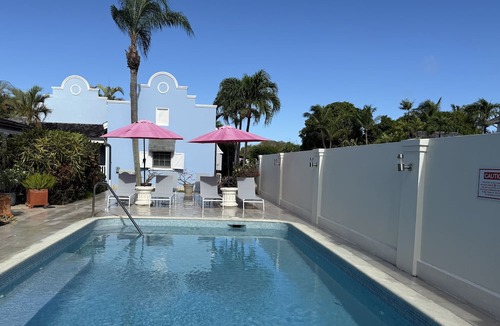 Porters Cottage | Stylish luxury traditional-style poolside villa nr. beach. Two ensuite bedrooms.