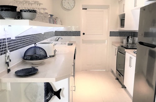 Porters Cottage | Stylish luxury traditional-style poolside villa nr. beach. Two ensuite bedrooms.