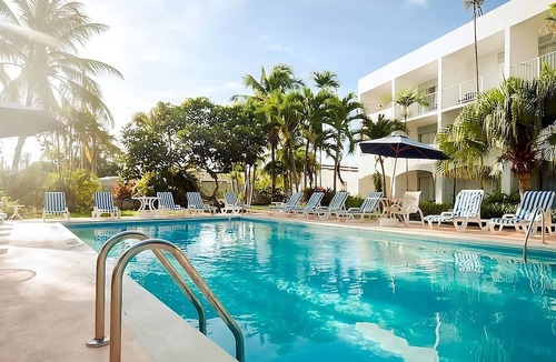 Dover Hotel | Enjoy Great Games and Events at Garrison Savannah! FREE Parking, Outdoor Pool!