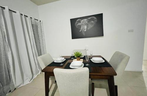 Boarded Hall Apartment | Chic Retreat BB, Bright, Gated 2BR Condo with pool and wifi